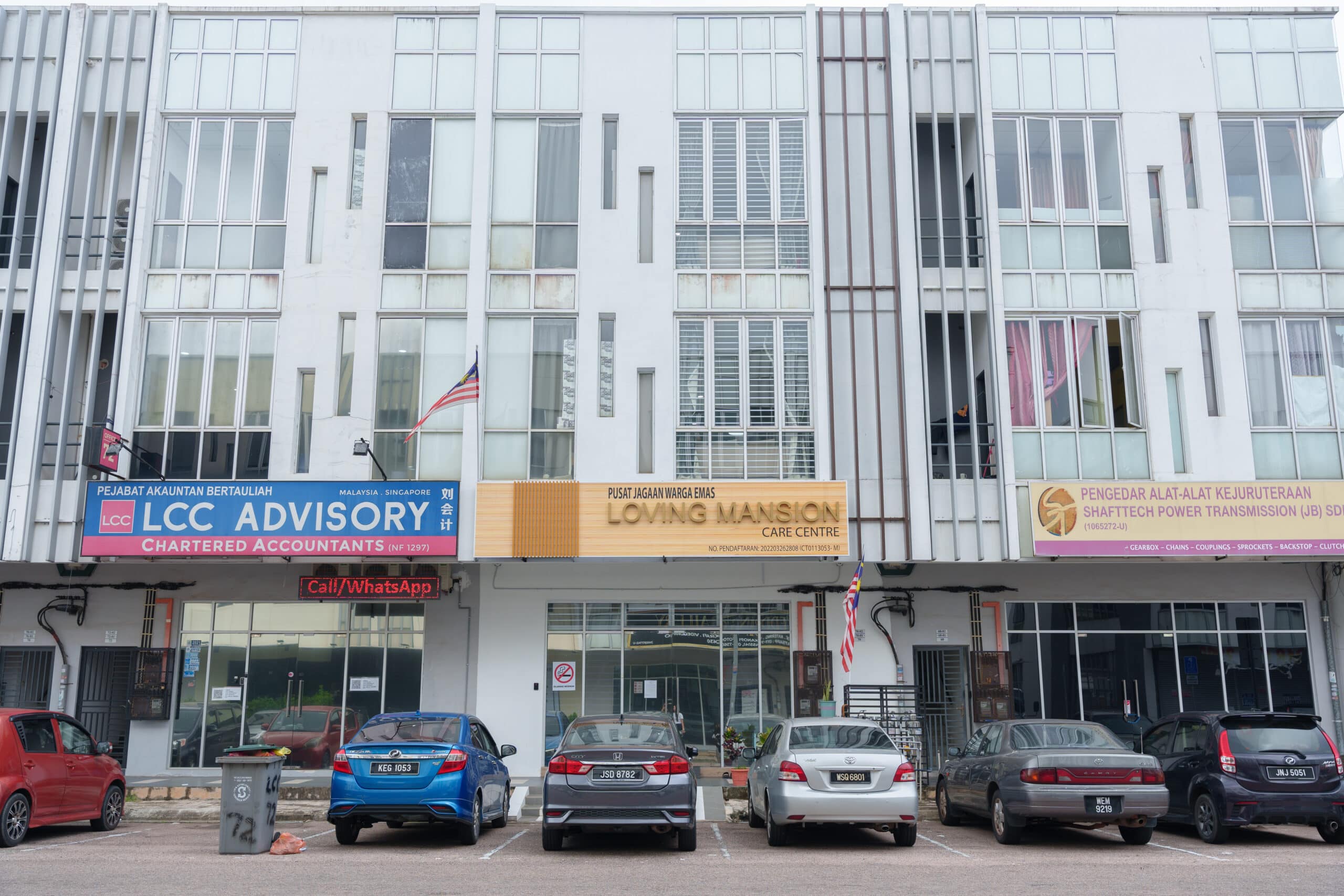 cars parked outside loving mansion jb