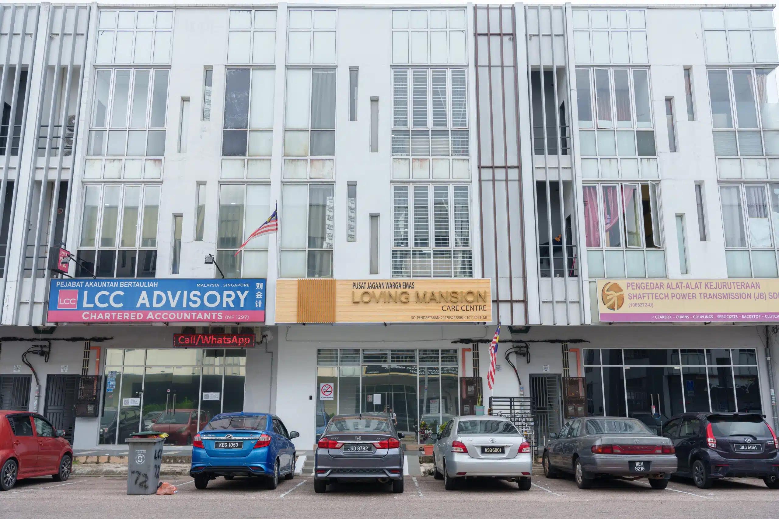 cars parked outside loving mansion jb